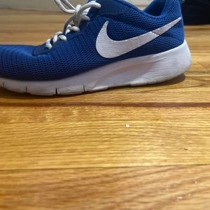 I am selling blue and white nike shoes